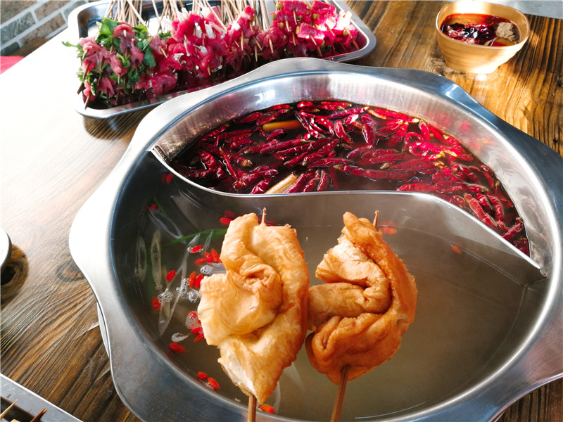 我问老板为啥把油条串这么多